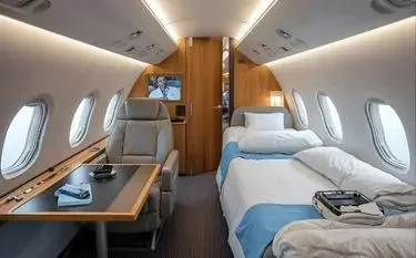 UK Air Ambulance & Medevac Charter Services Medical transport aircraft interior with hospital bed, monitoring equipment, and emergency care setup