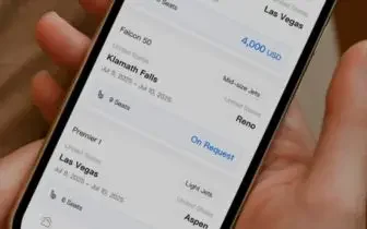 Mobile app displaying private jet flight bookings with destinations and costs for UK travel planning