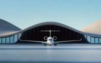 Modern aircraft hangar with sleek white private jet positioned for departure under curved architectural roof