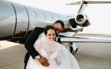 Private Jet Charter Flights for Destination Weddings: Personalisation Takes Flight Newlywed couple embracing beside luxury private jet on wedding day, showcasing romantic charter flight experience