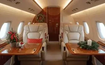 Luxurious private jet cabin for a festive christmas arrangements holiday greenery polished wood card item