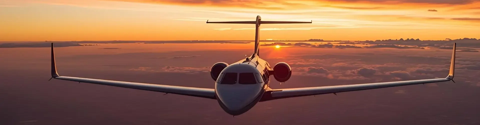 The Ultimate Guide to Private Jet Charter Services in the UK Private jet flying above clouds during golden sunset showcasing luxury charter flight experience