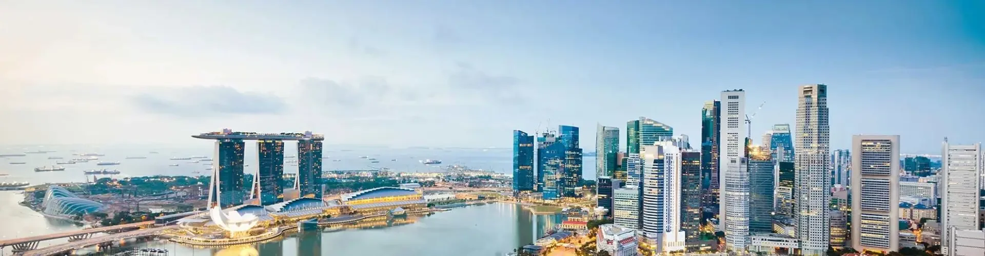 Luxury private jet soaring above Singapore's Marina Bay skyline with iconic towers and waterfront