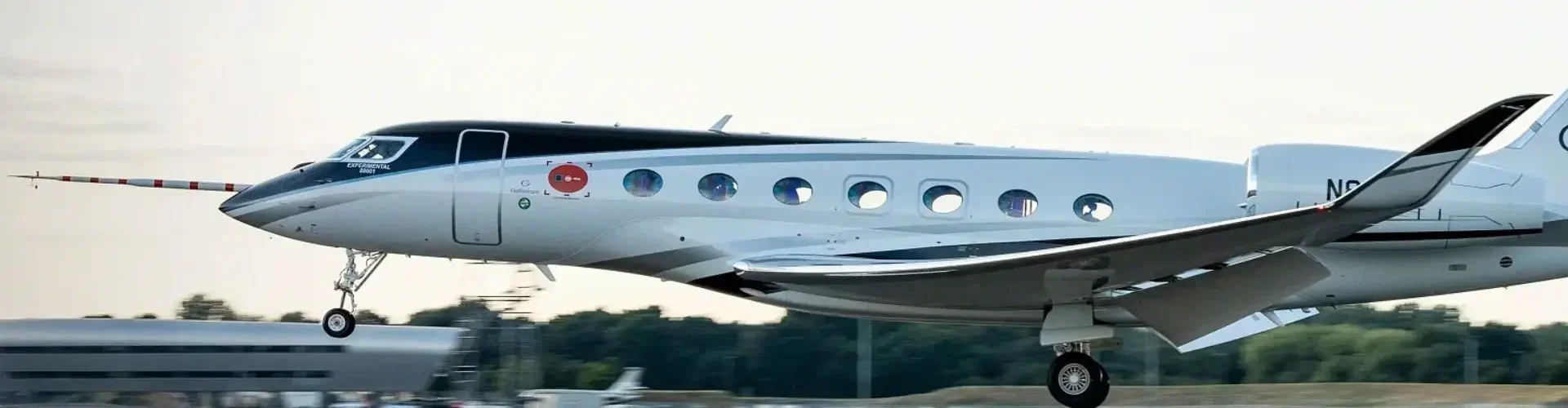 Private Jet from London RAF Northolt to Geneva (EGWU → LSGG) Silver turboprop aircraft landing runway golden hour luxury private jet charter flights