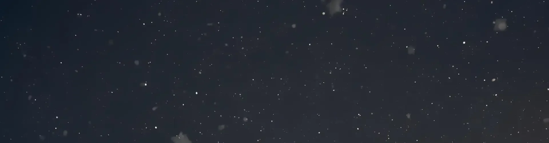 Luxury private jet illuminated on snowy tarmac at night, ready for last-minute holiday travel departure