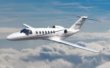 How Many Private Jets Are Based in Singapore? White Citation CJ4 private jet cruising above clouds showcasing Singapore's luxury charter fleet options