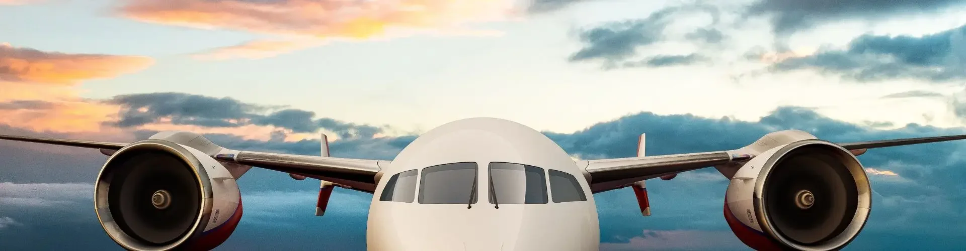 Private jet flying above turquoise waters at sunset showcasing luxury travel and exclusive aviation benefits