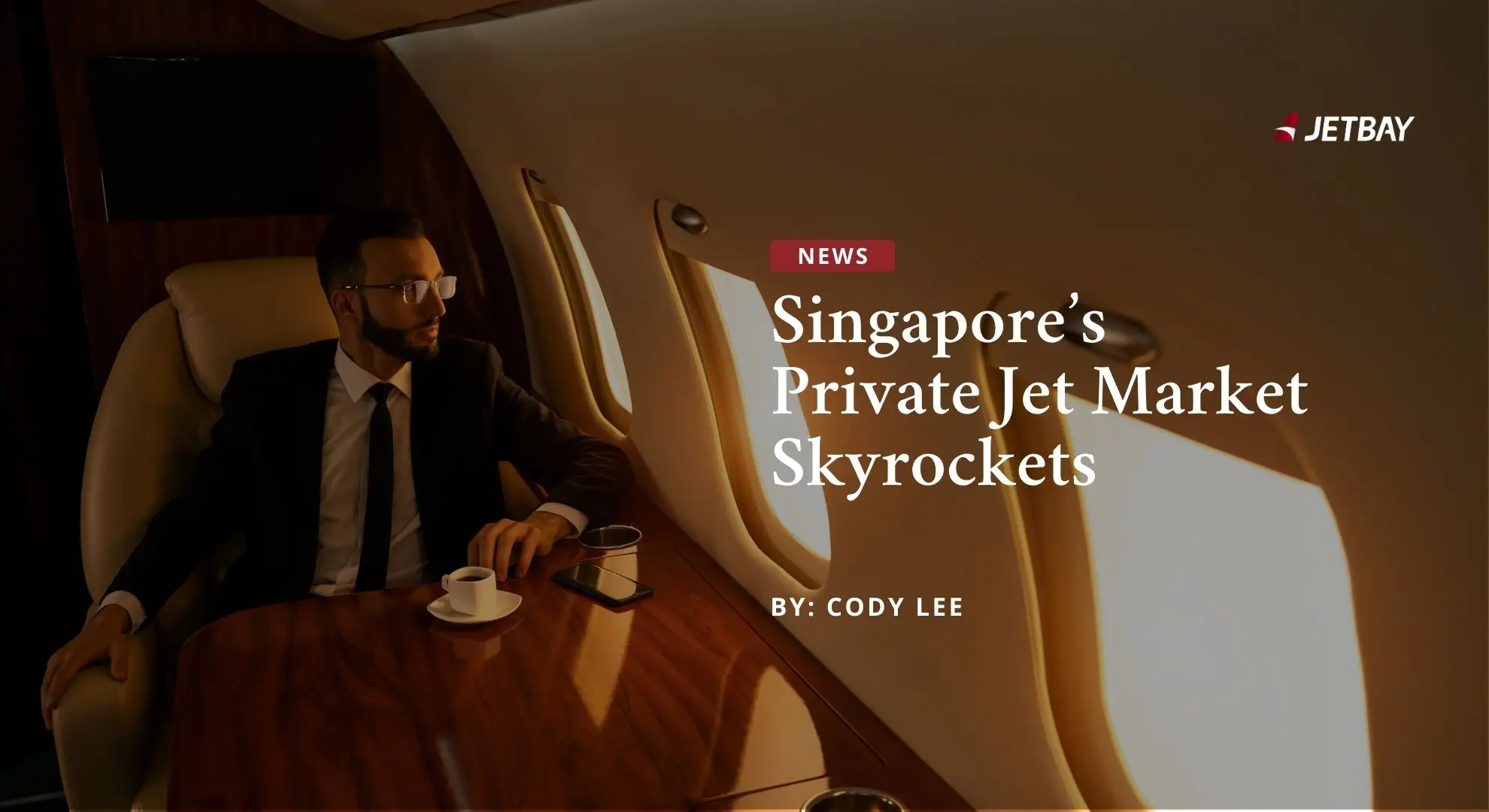 Business executive in luxury private jet cabin reading Singapore market growth report with JETBAY branding