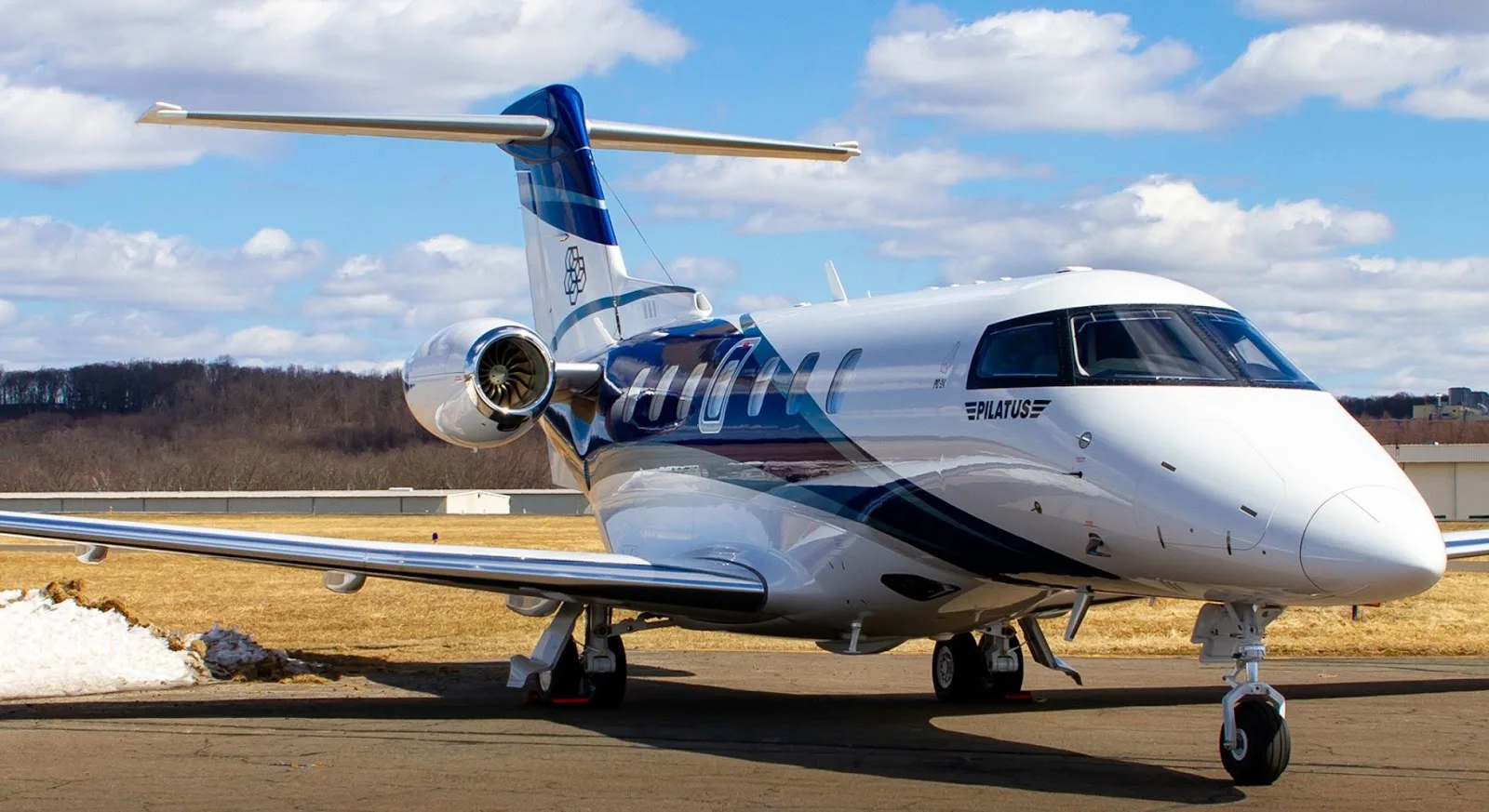 Pilatus PC-24 private jet on airport runway for business aviation charter flights