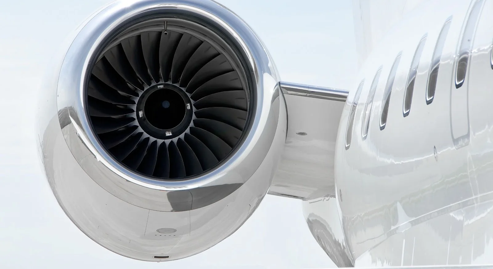 Close-up view of private jet engine turbine blades showcasing advanced aviation technology for luxury travel
