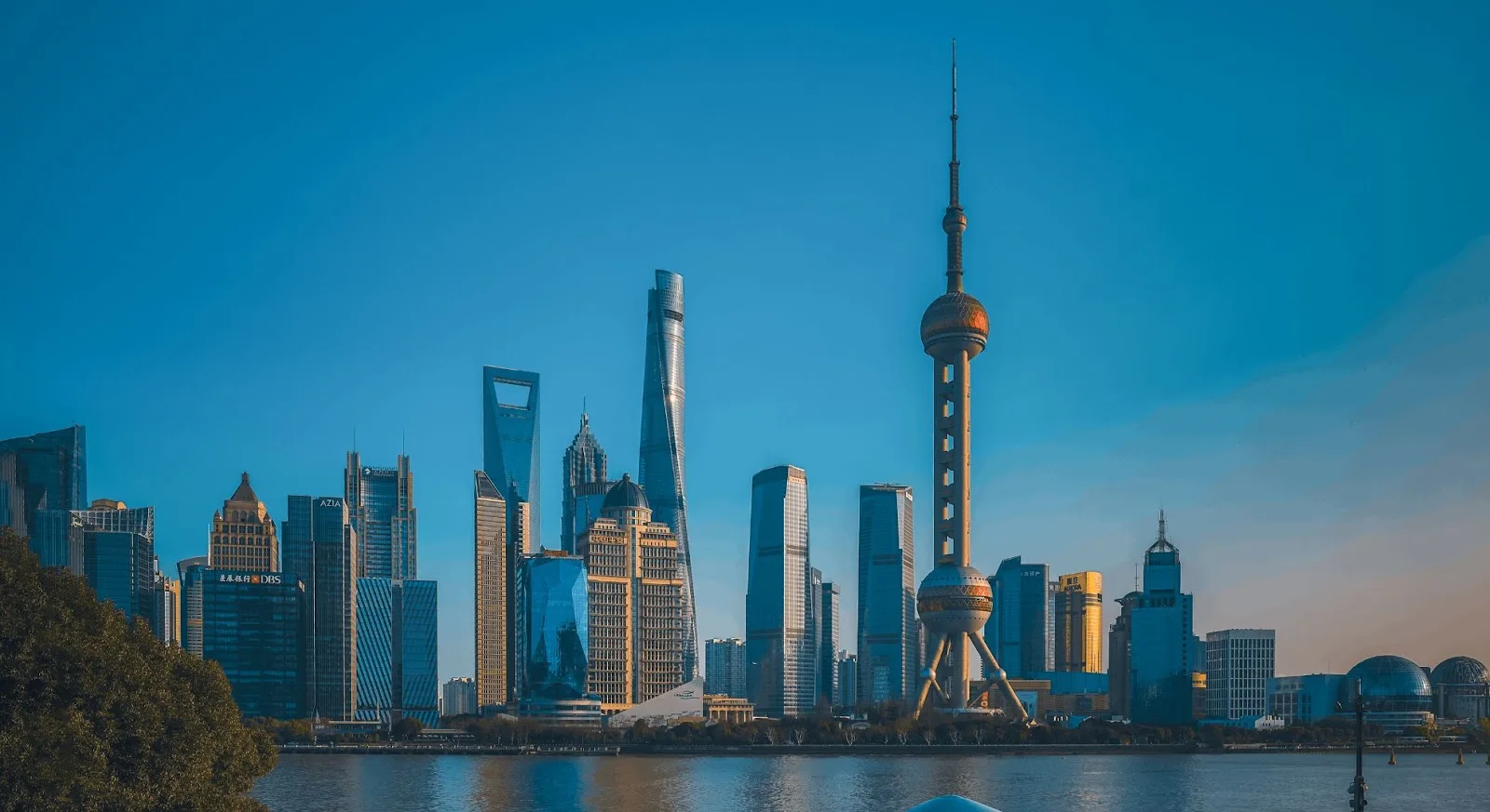 Shanghai's iconic skyline featuring Oriental Pearl Tower and modern skyscrapers for luxury private jet travel