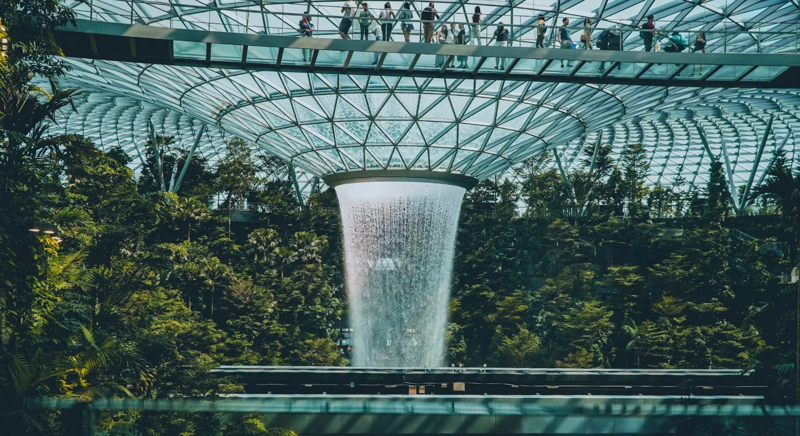 Spectacular indoor waterfall at Singapore Changi Airport showcasing the city's modern architecture and luxury travel infrastructure