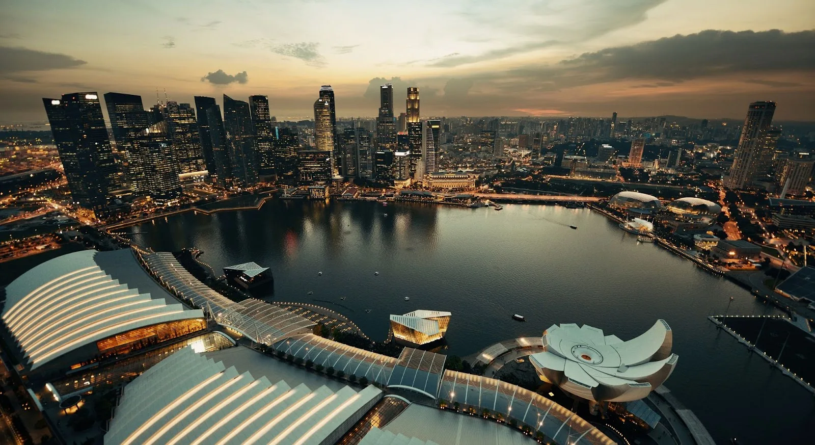 Singapore skyline at dusk showcasing Marina Bay's iconic architecture and waterfront for luxury jet travel
