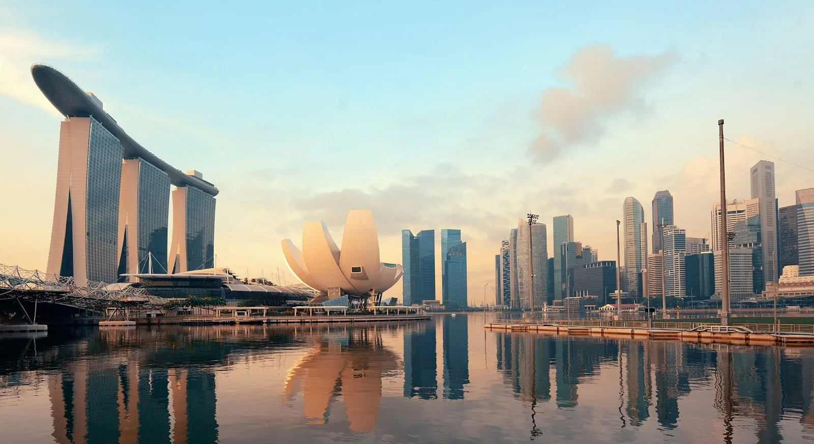 Singapore skyline at golden hour showcasing Marina Bay Sands and financial district for luxury jet travel