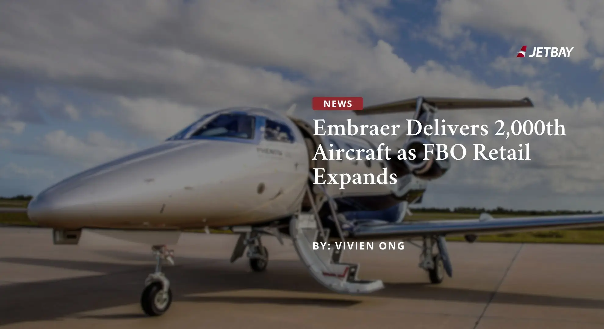 White Embraer business jet on tarmac showcasing milestone 2,000th aircraft delivery for luxury aviation market