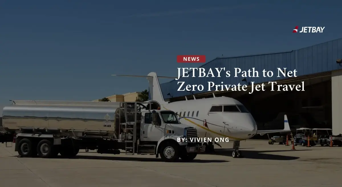 White private jet being refueled at airport hangar showcasing JETBAY's sustainable aviation fuel initiatives