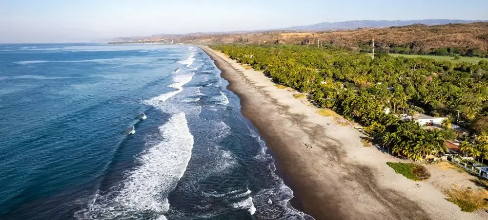 Aerial view of La Libertad coastline and Pacific surf in El Salvador