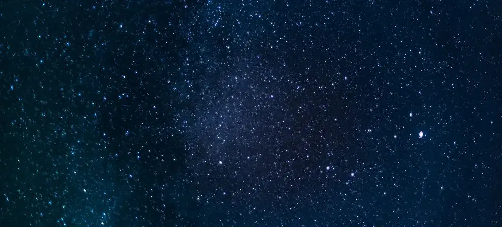 Star-filled night sky over Bannau Brycheiniog, evoking the dark sky reserve experience accessible via private jet charter