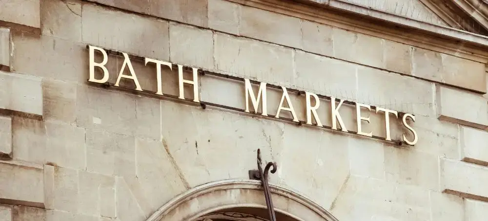 Gold lettering of Bath Markets sign, a landmark destination accessible by private jet charter to Bath, England