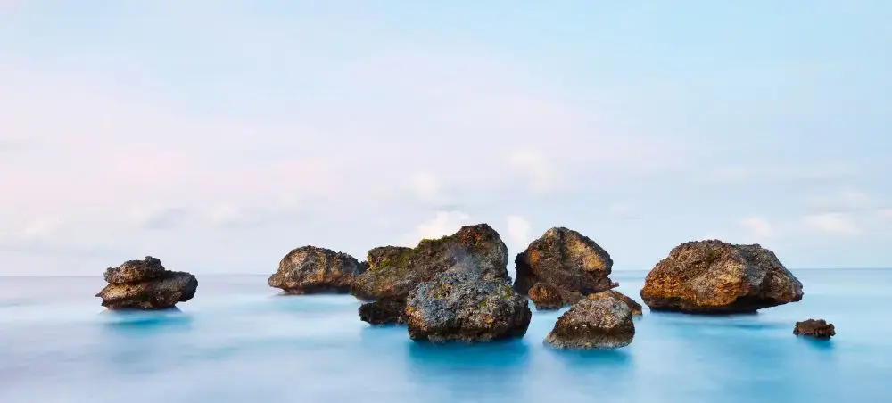 Large boulders on Bathsheba Beach with Atlantic waves in Barbados