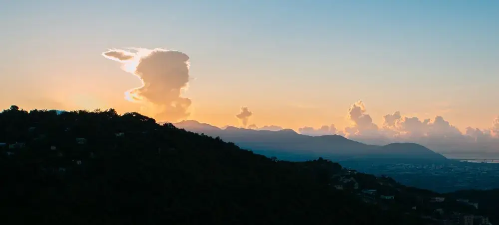 Blue Mountains rising above Kingston, Jamaica with tropical hillside scenery