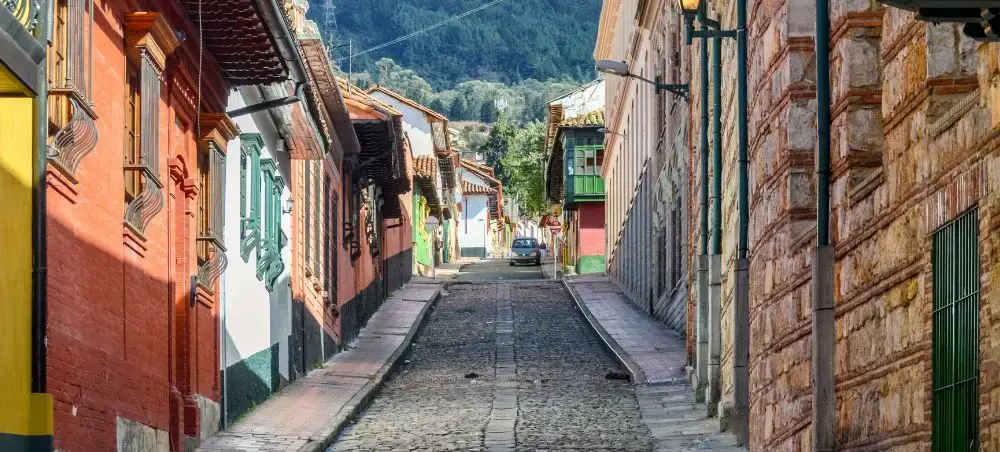Colonial buildings and cobbled street in La Candelaria historic district of Bogotá Colombia
