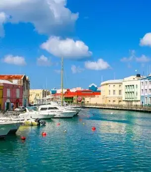 Colorful waterfront buildings and yachts moored in Bridgetown Harbour, Barbados