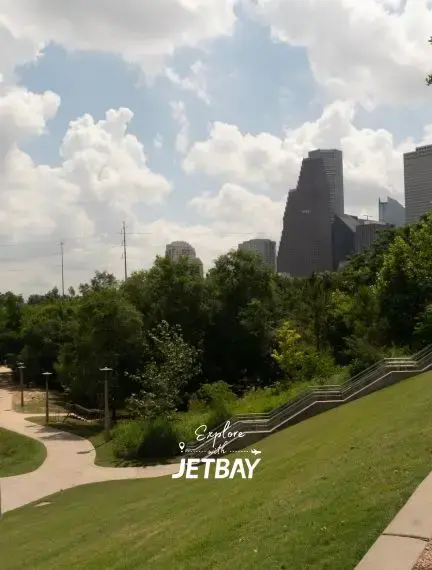 Buffalo Bayou Park in Houston with trails, green space, and the downtown skyline in the background