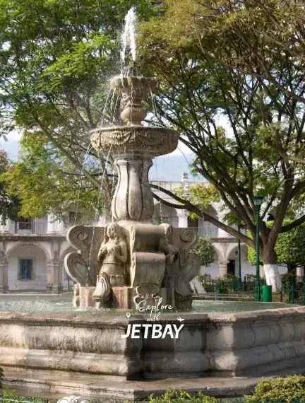 Central Park in Antigua Guatemala surrounded by colonial architecture