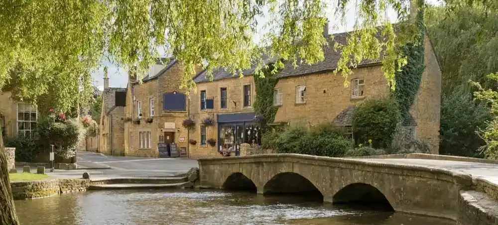 Charming Cotswolds village with honey-stone cottages, an English countryside destination accessible by private jet charter