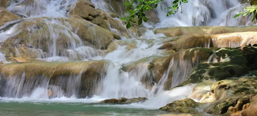 Dunn’s River Falls cascading through tropical greenery near Ocho Rios, Jamaica
