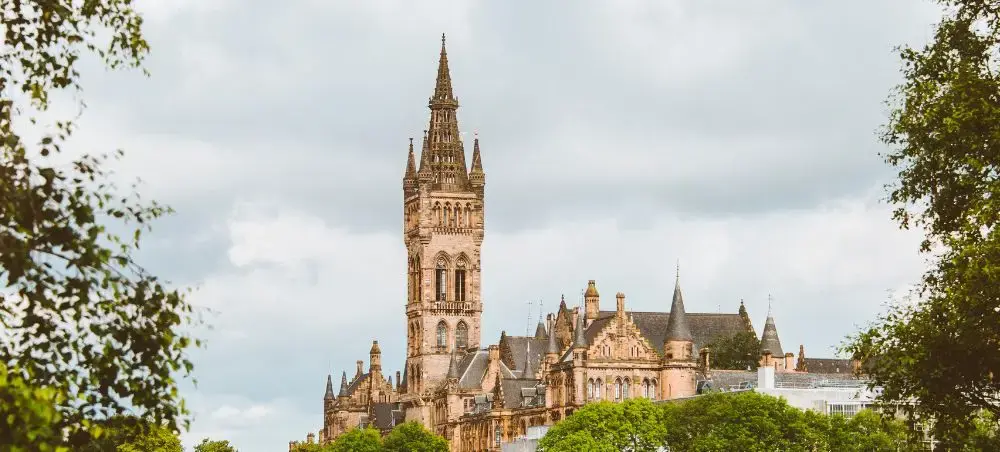 Gothic spire of the University of Glasgow, a landmark visible from private jet approaches into Glasgow
