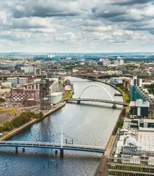 Aerial view of Glasgow city centre and the River Clyde with the iconic Clyde Arc bridge in Scotland