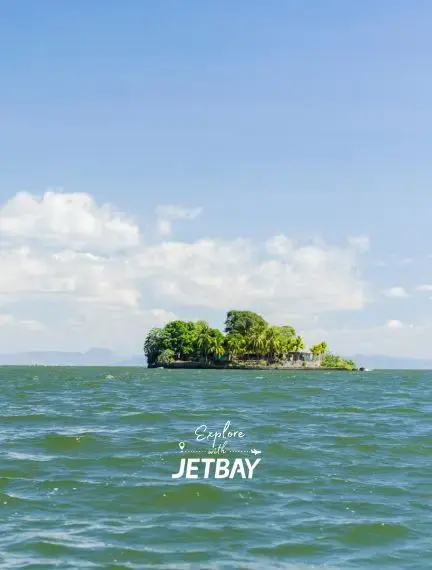 Lush tropical islet surrounded by turquoise waters of Lake Nicaragua near Granada