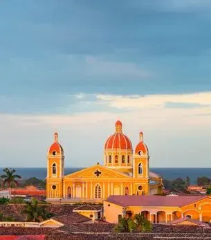 Panorama of Granada at sunset with the Nicaragua lake in the background