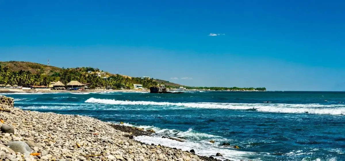 Pacific coastline in La Libertad, El Salvador, with beach and coastal hills