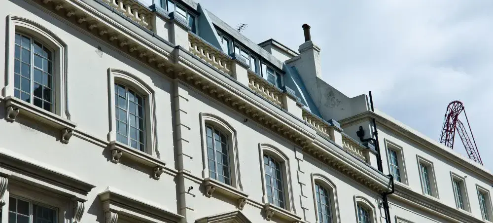 Grand white stucco Georgian building facade in Mayfair, London, reflecting the city's iconic architectural heritage