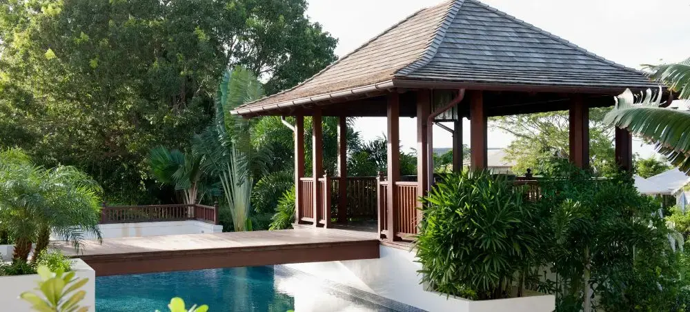 Luxury tropical villa pavilion with private pool surrounded by lush gardens in Holetown, Barbados