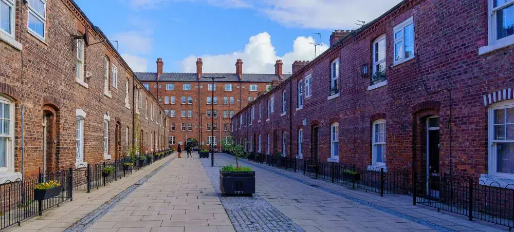 Historic red-brick terraced street in Ancoats district in Manchester, reflecting the city's industrial connection