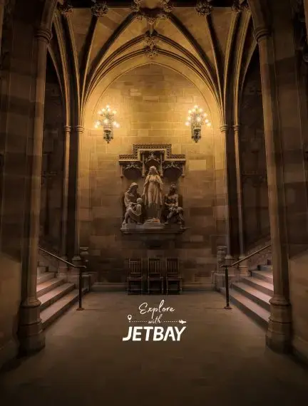 Neo-Gothic reading room and stone arches inside John Rylands Library in Manchester