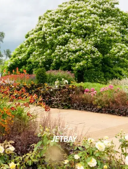 Seasonal planting and pathways inside the walled garden at RHS Garden Bridgewater