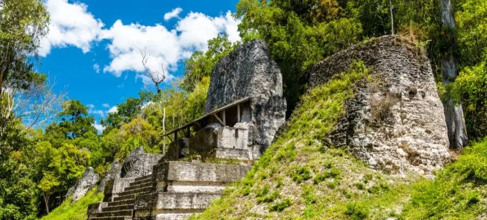 Maya temple above jungle canopy near Flores in Guatemala’s Peten region