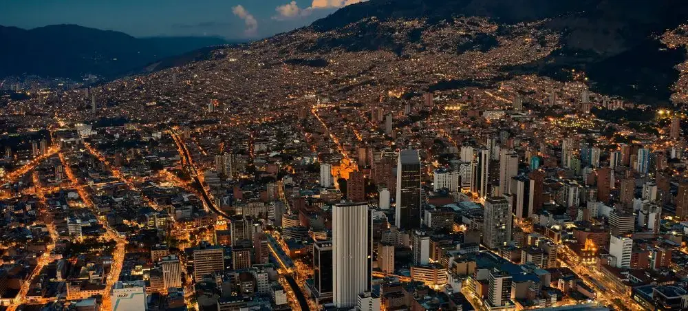 Aerial view of Medellín Colombia surrounded by mountains at night