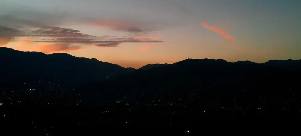 Medellín Colombia skyline at dusk with mountains surrounding the city