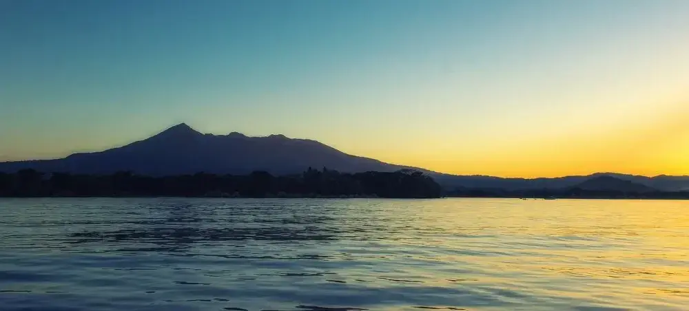 Lake Nicaragua with scenic view of the Mombacho volcano in the background