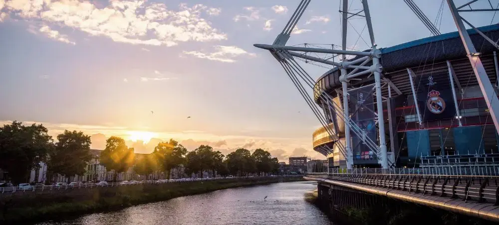 Principality Stadium at sunset beside the River Taff in Cardiff, Wales
