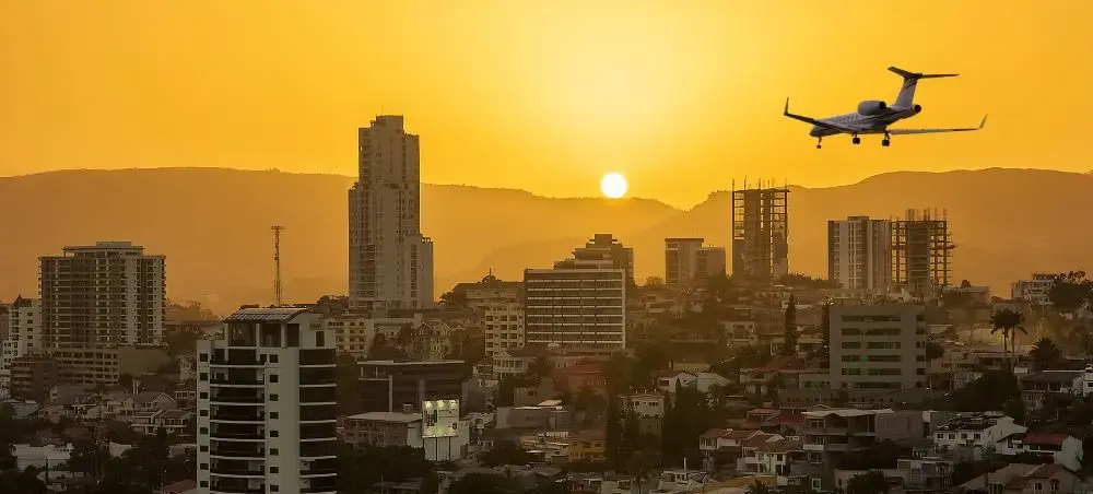 Private jet flying during sunset for charter departure in Honduras
