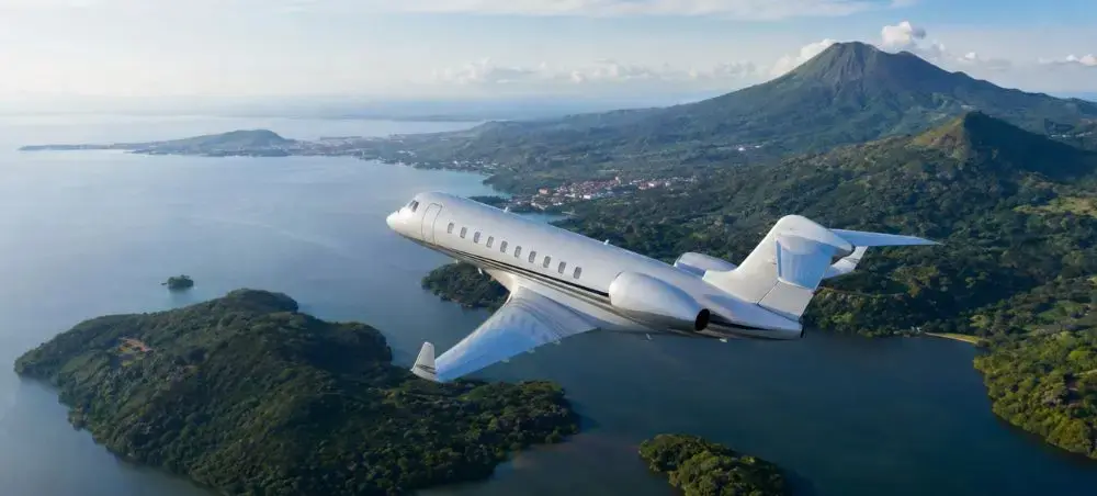 Private jet flying above Lake Nicaragua near Granada with volcanic scenery below