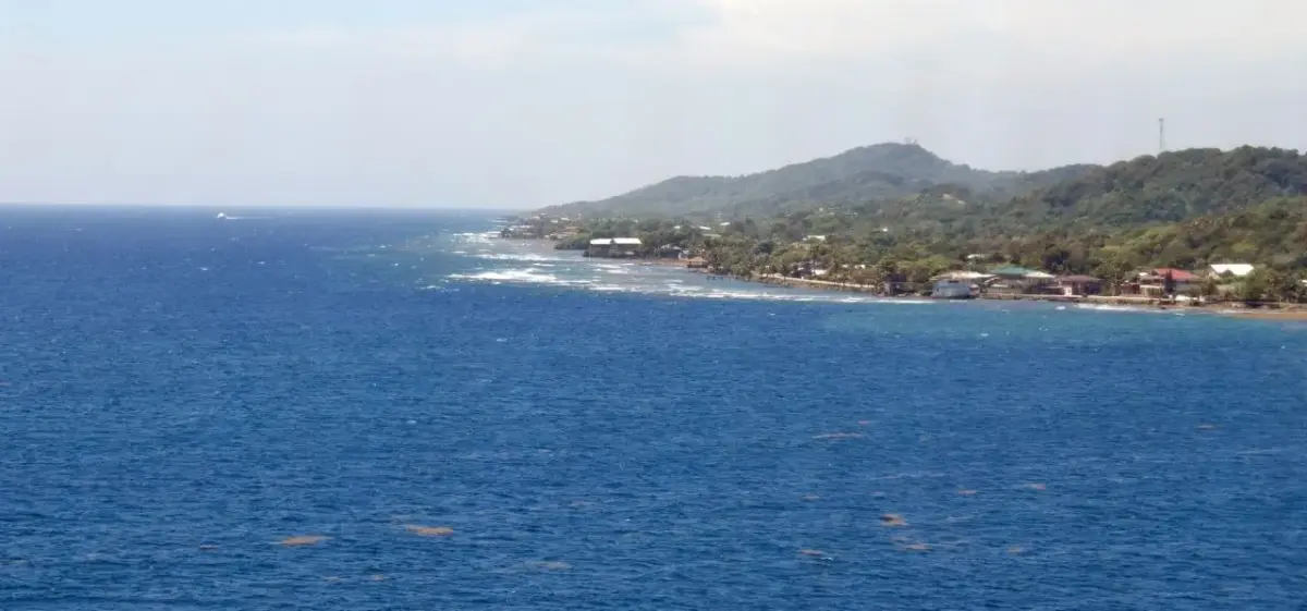 Aerial view of Roatán, Honduras, with turquoise water and island coastline