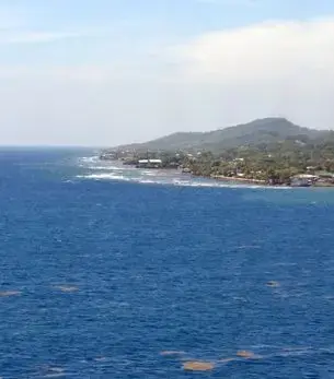Aerial view of Roatán, Honduras, with turquoise water and island coastline